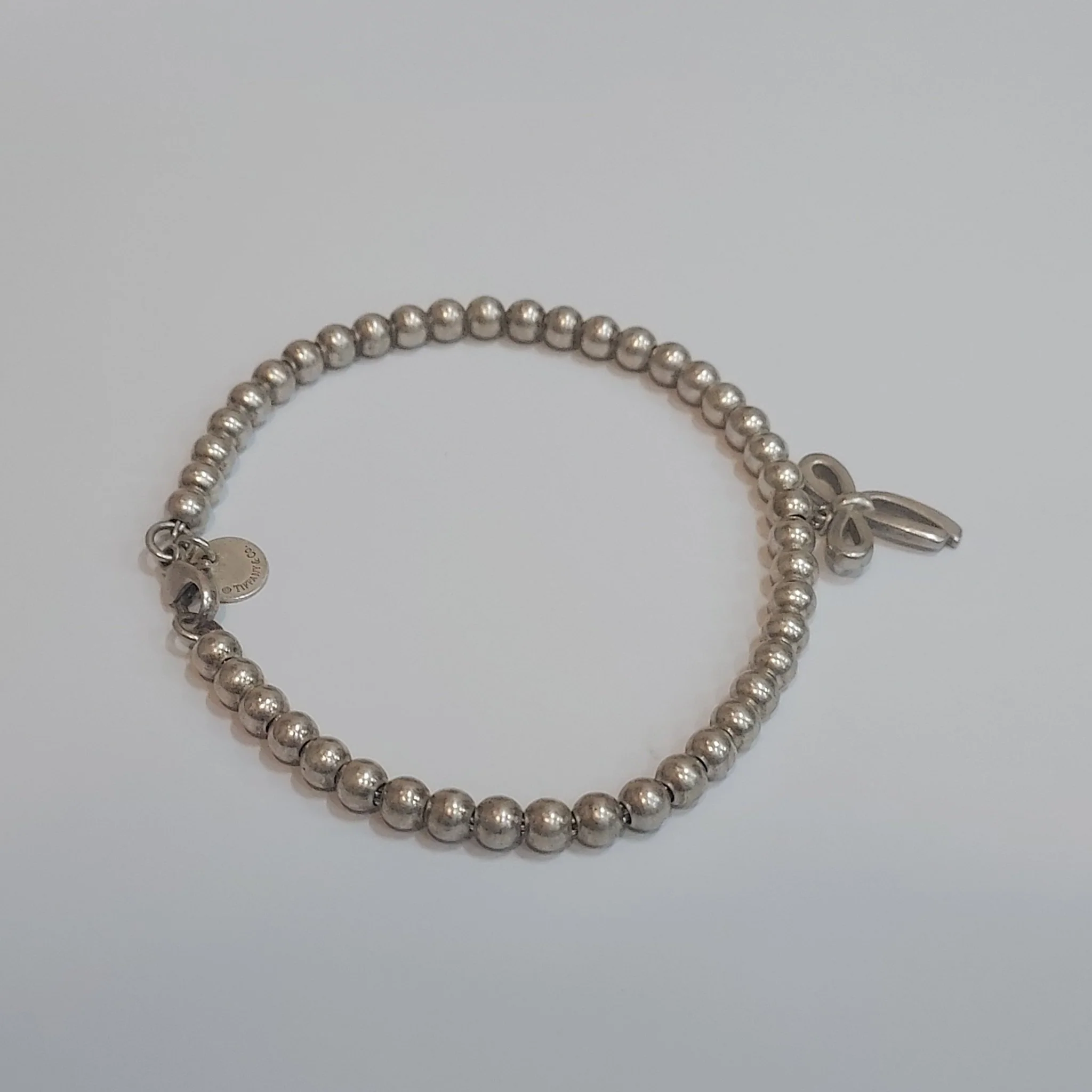 Tiffany & Co. Sterling Silver Bow Charm Bracelet - Image 2